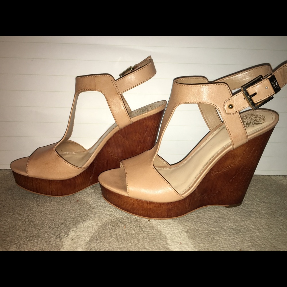 Tan/nude wedge heels with gold buckle.